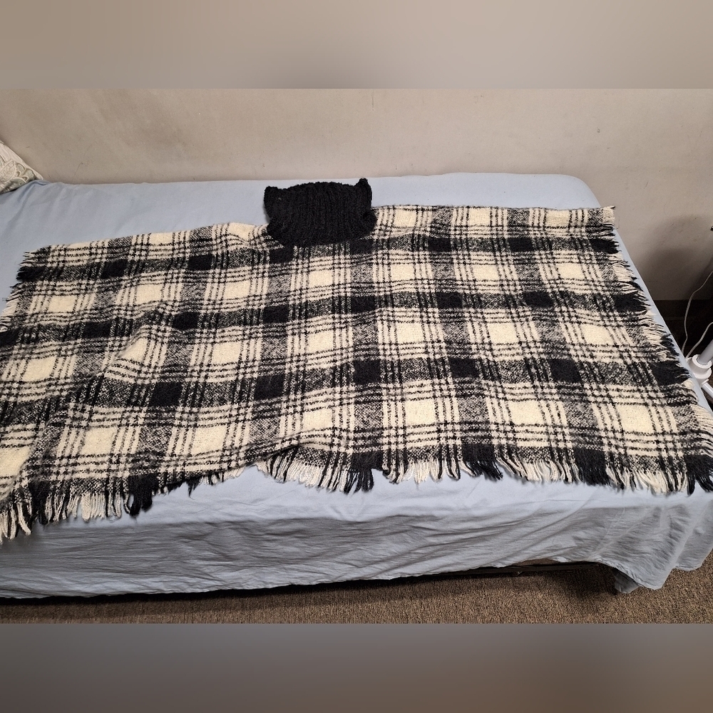 Wonderly Poncho in a large buffalo check pattern with a Turtleneck